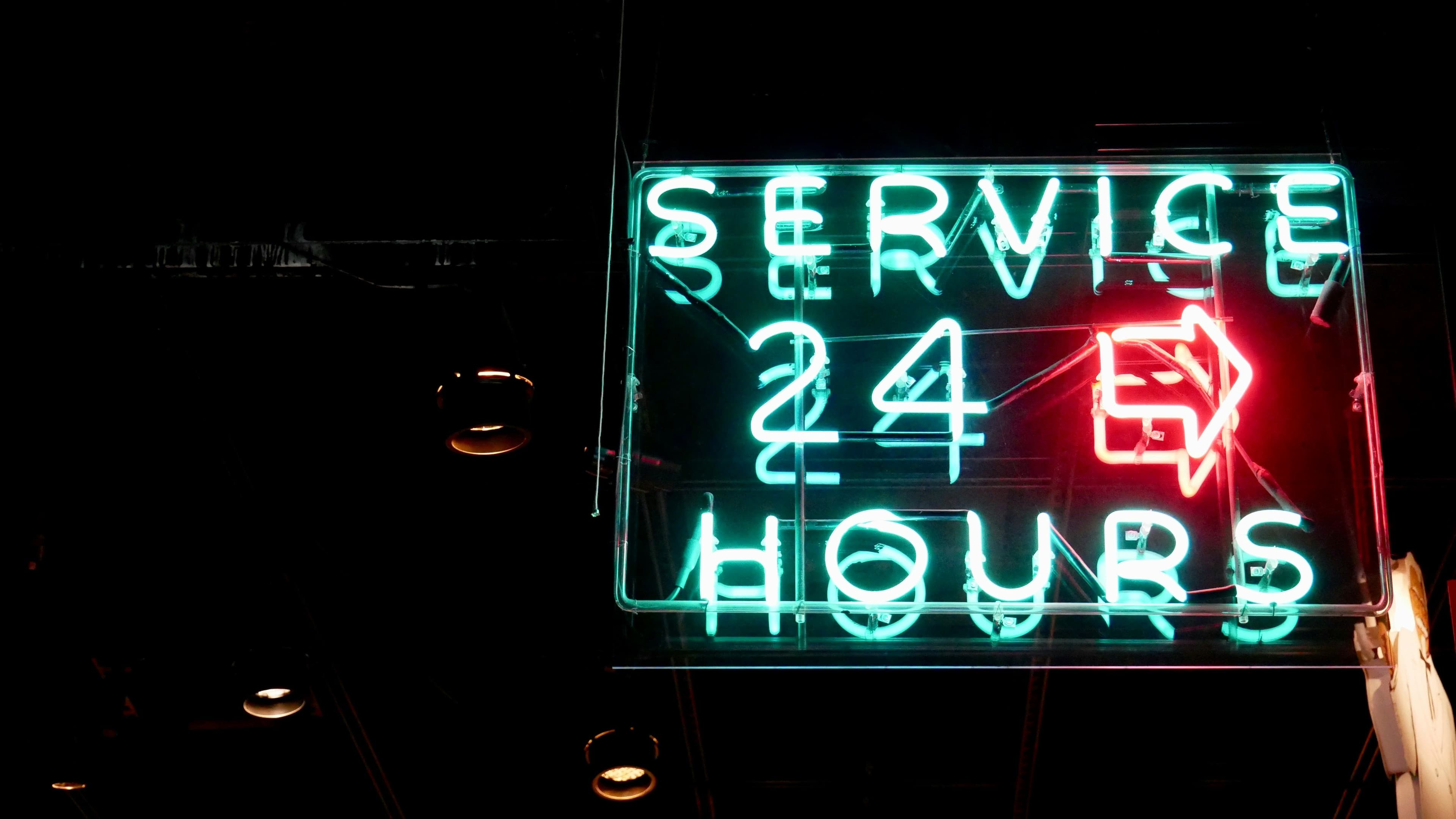 Neon sign with service 24 hours text